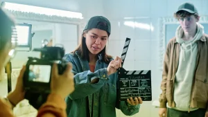 student filmmakers filming in a public restroom